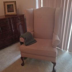 Pink wing back chair