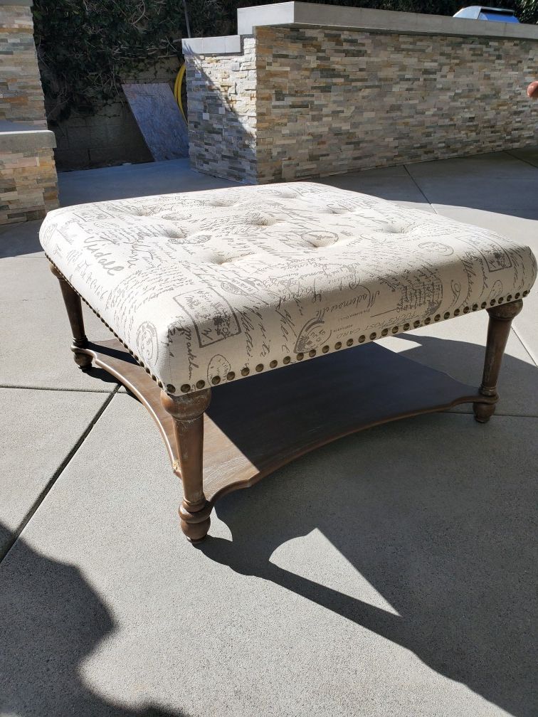 Ottoman - has one spot with scratch on wood base (see photo)