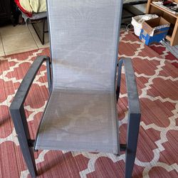 An outdoor chair right by the pool