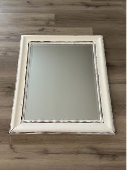 rectangular wall mirror with a farmhouse-style frame