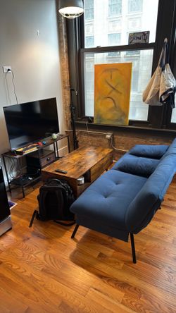 TV, TV stand, coffee table and couch