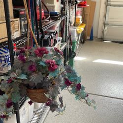Hanging basket of artificial flowers