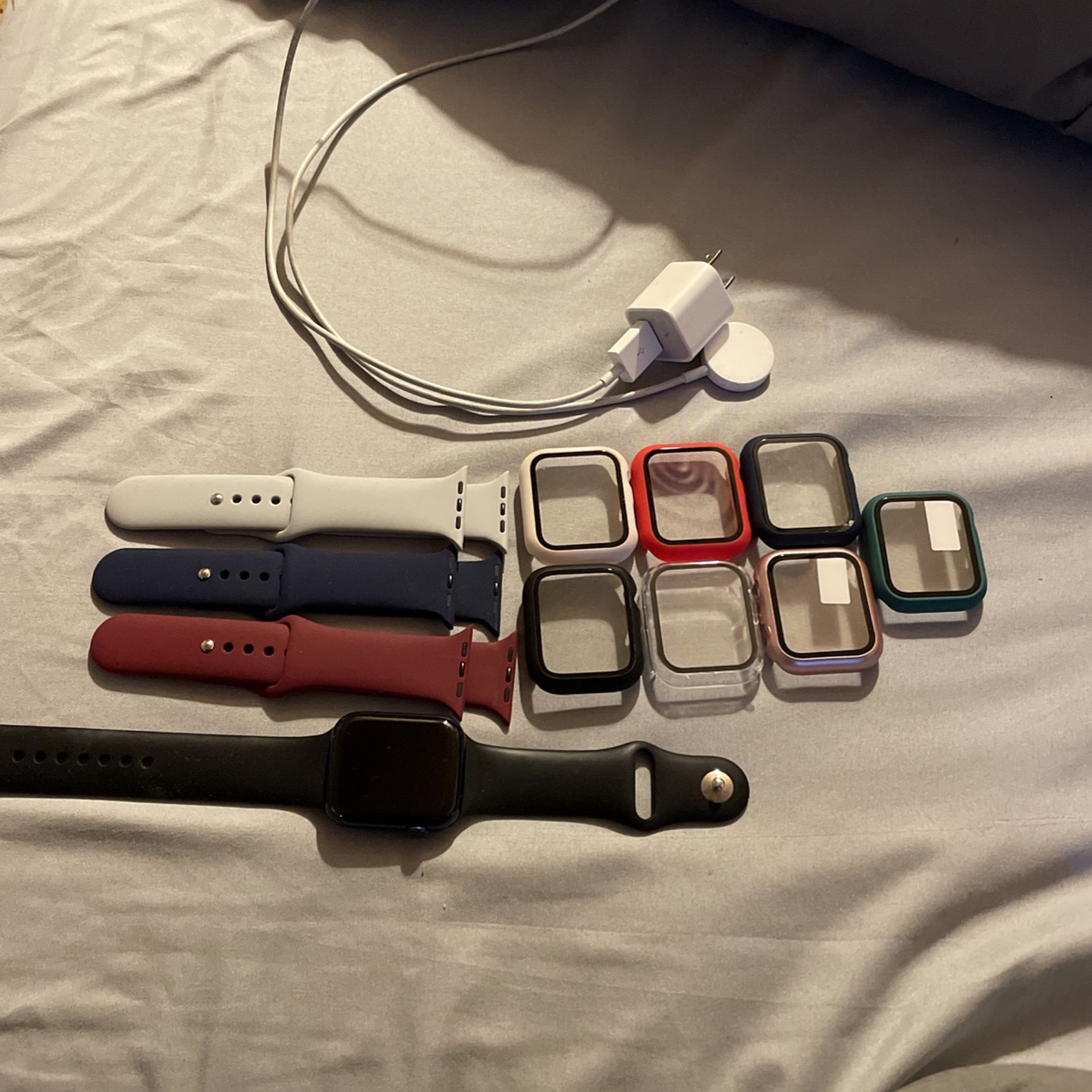 Apple Watch S6/  4 Bands,7 Screen Protectors and a charger
