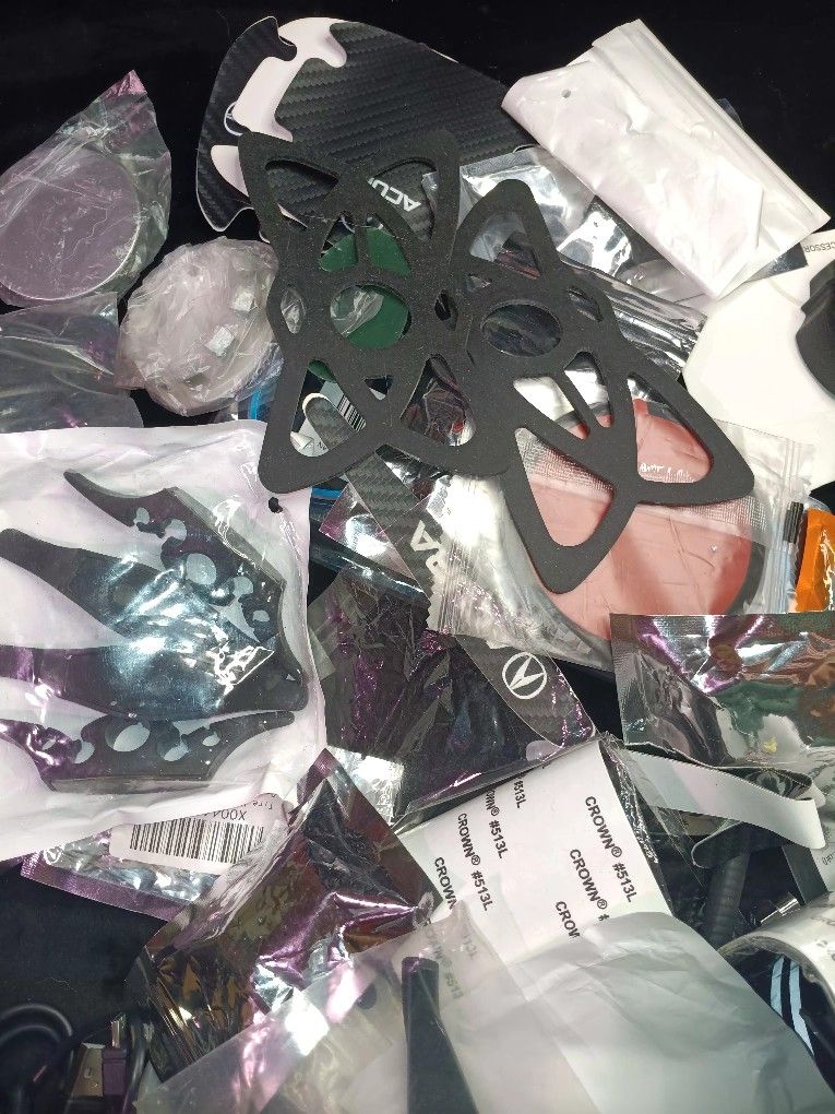 Assorted car accessories for rap ford , dodge , jeep cadillac and others includes decals , other miscellaneous parts