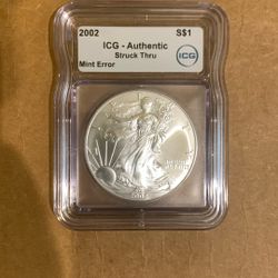 2002 ICG Authentic Silver Eagle Struck Thru Mint Error