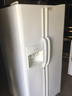 White side by side refrigerator/ one year warranty/ delivery and installation are available