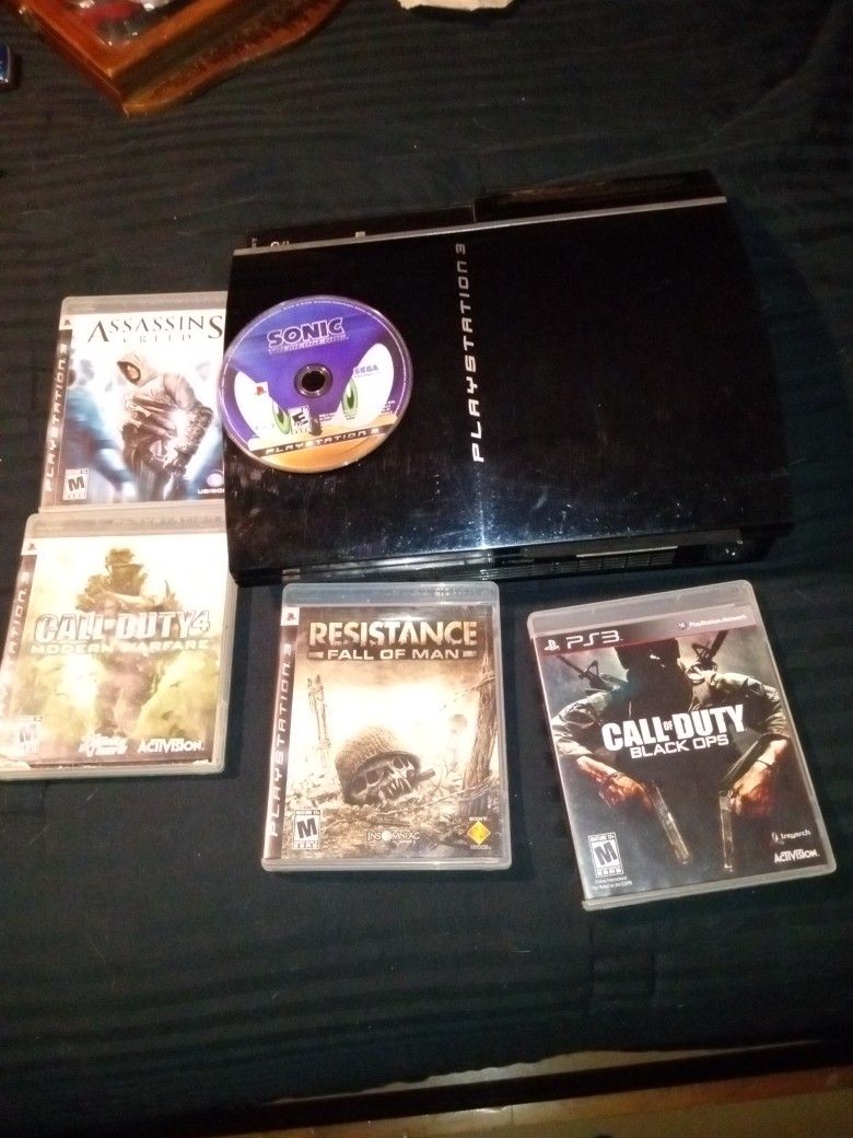 PlayStation 3 With Power And HDMI Cables, As Well As 5 Popular Games