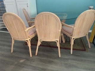 Rattan table and 4 matching chairs & more