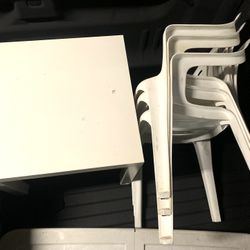 Small Table And Three Stackable Chairs