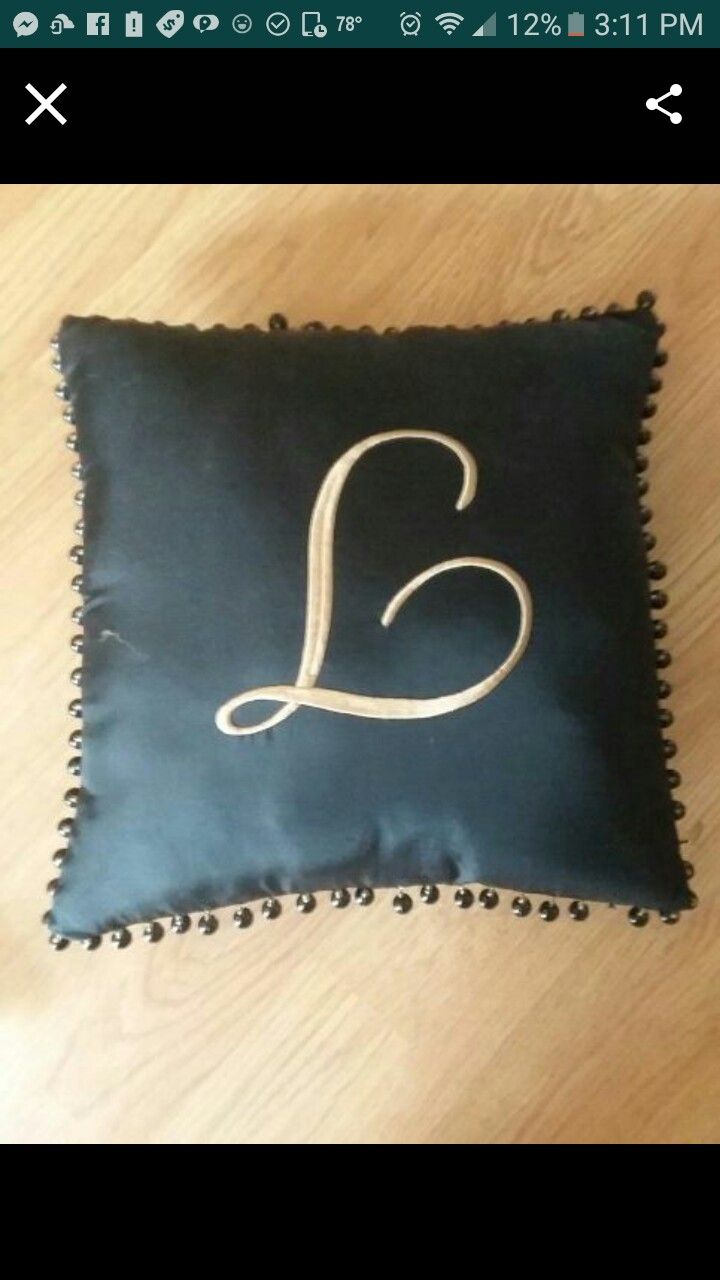 L monogram pillow