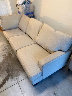 L Shaped beige couch 7 ft by 4 feet