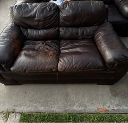 Leather love seat and couch