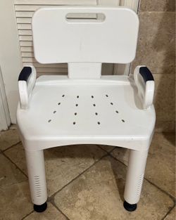 Shower chair with armrest adjustable