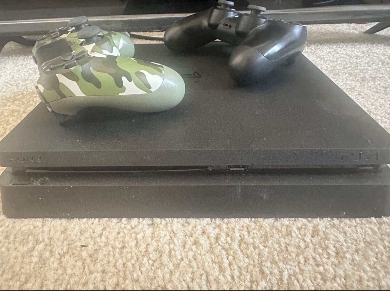 Sony PS4 Slim 1TB console + Two controllers