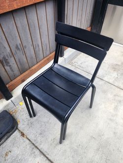 26x metal outdoor chairs with worn glides.