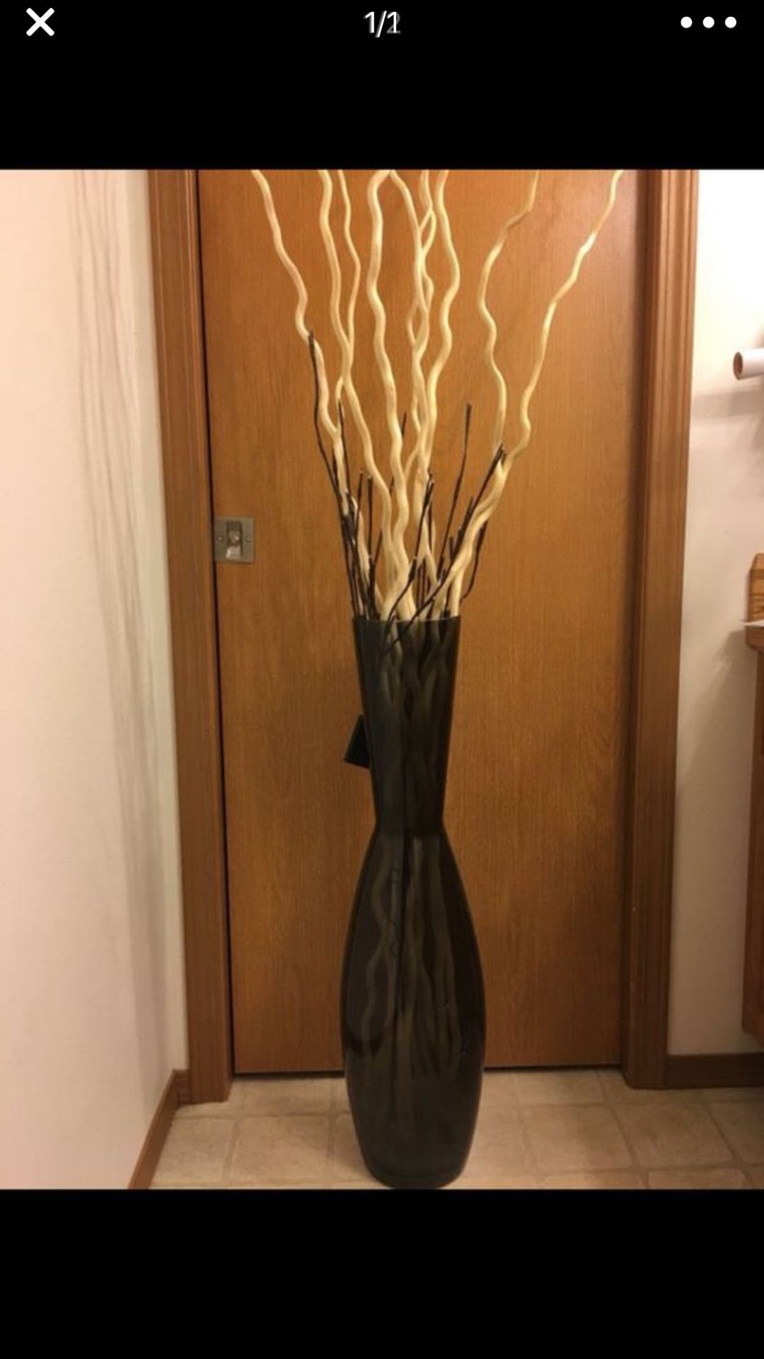 Black vase with Bamboo sticks with lights