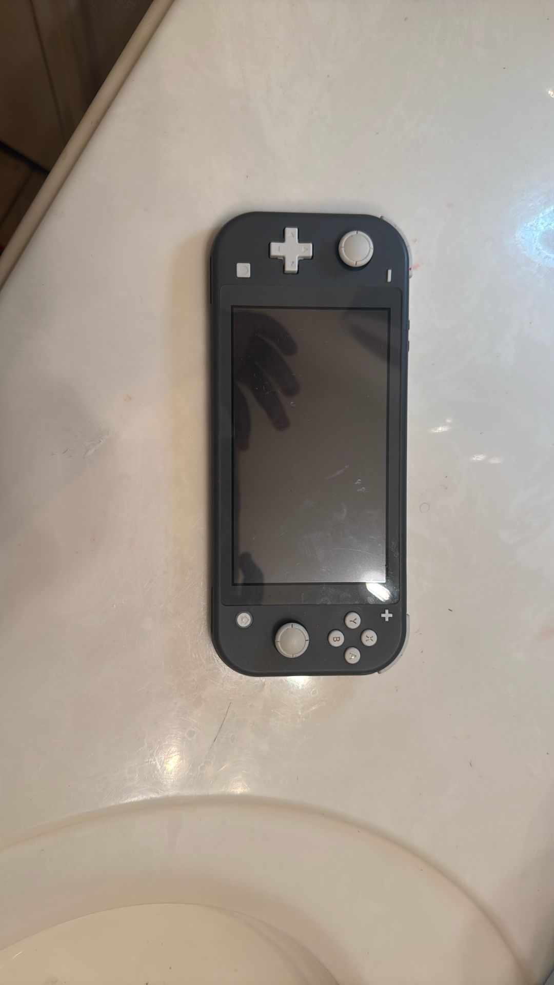 Nintendo Switch Lite (Willing To Take Trades For An iPad Or Any Apple Product)