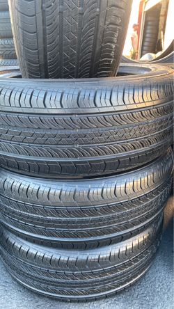 a set of tires brand Continental size 215/55R17