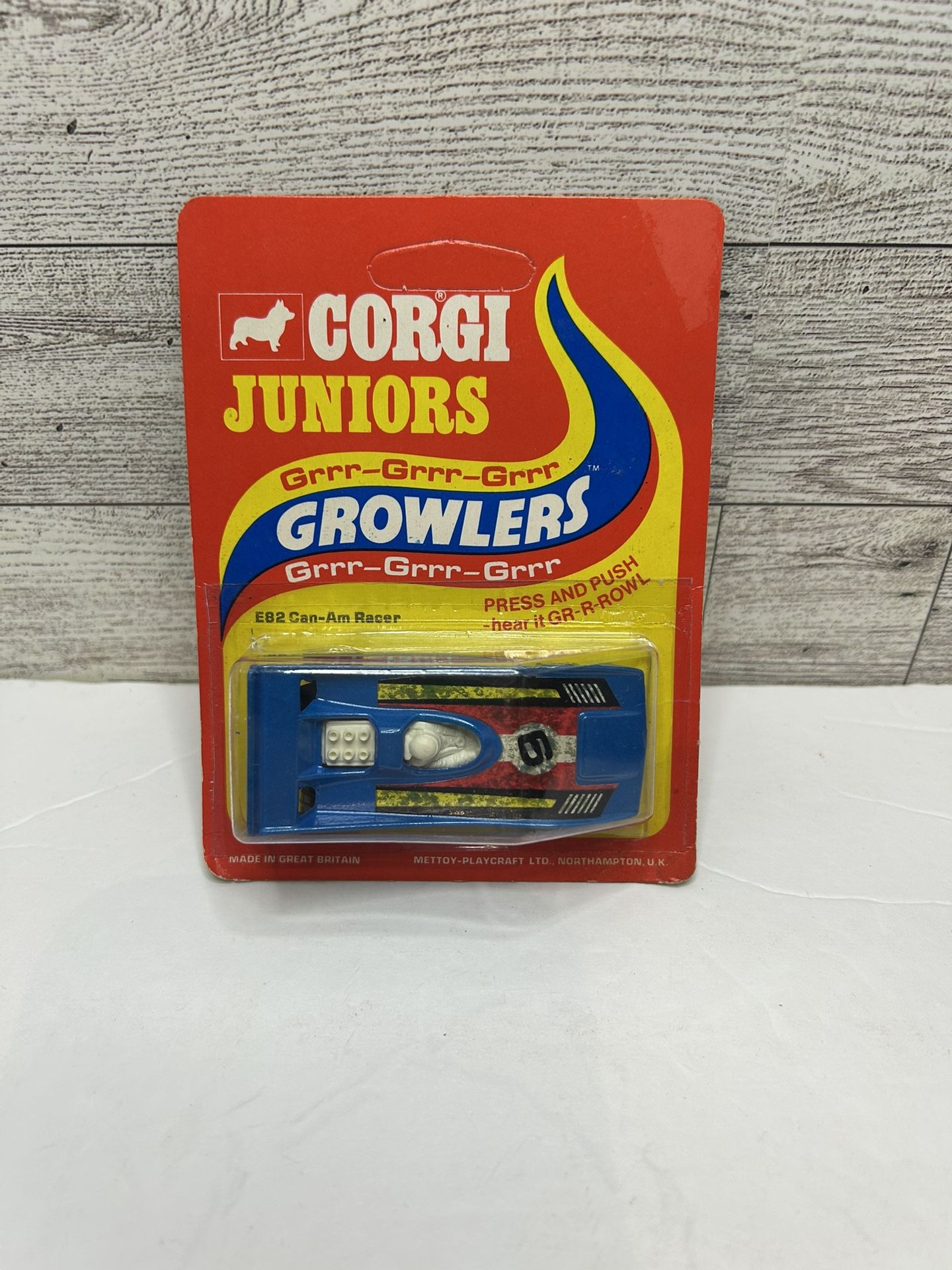 Vintage Corgi Juniors Growlers Blue ‘1975 E82 Can-Am Racer / Press and Push - Hear it GR - R Rowl • Die Cast Metal • Made in China The Card is Unpunis