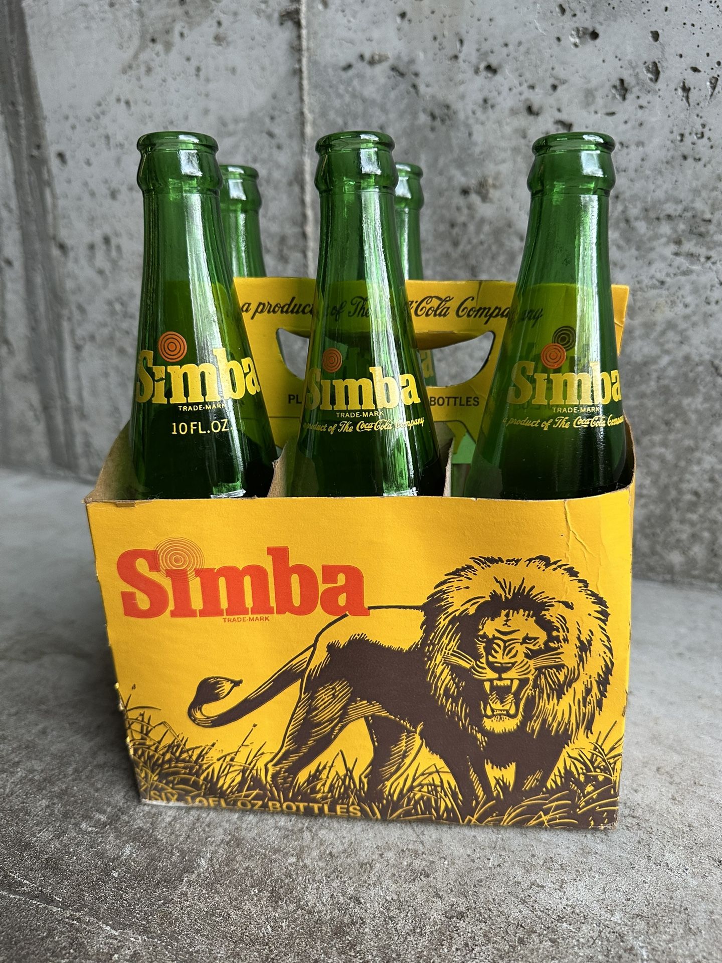Five (5) Simba vintage soda pop bottles plus original carrier case