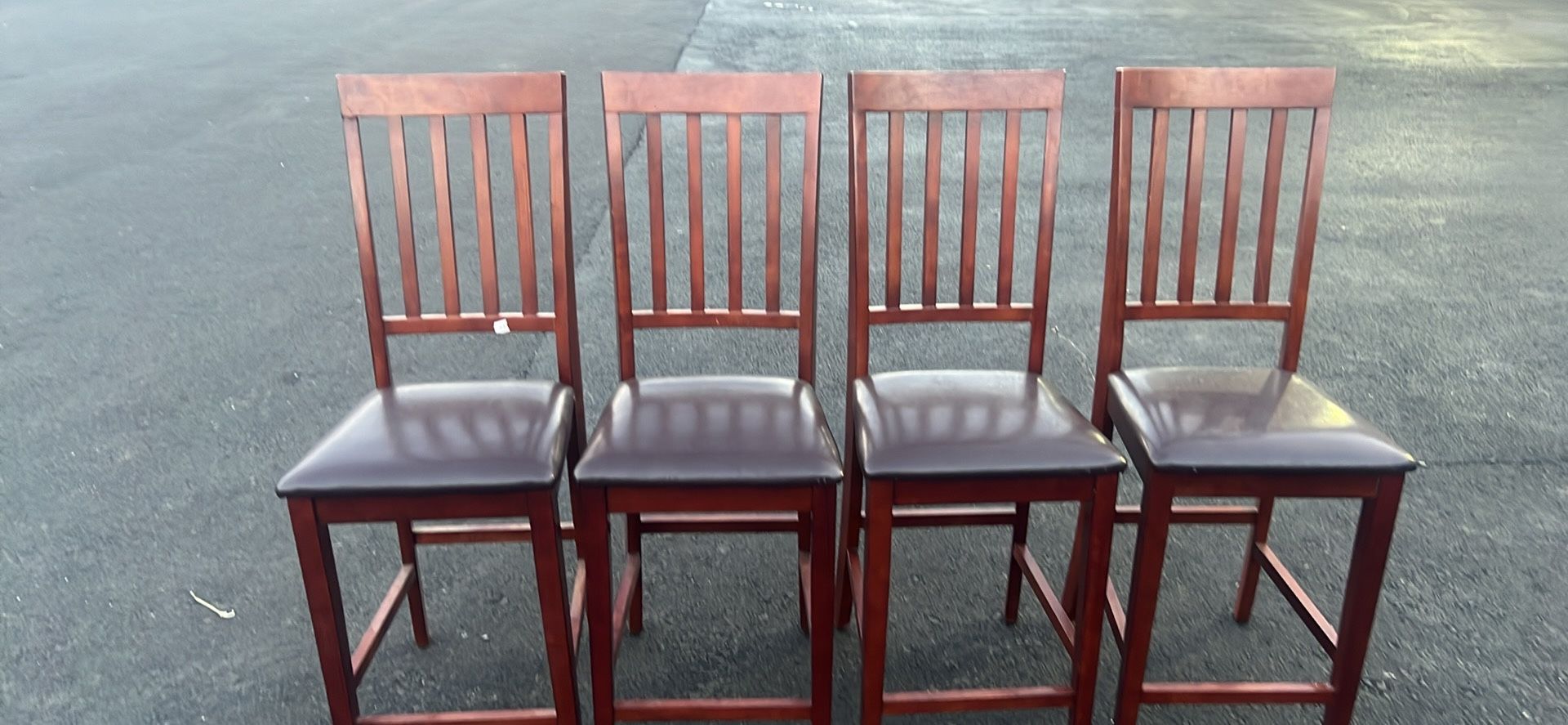 25”h 4 leather chairs yes like a new