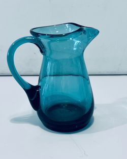 Vintage 1950’s Hand Blown Teal Glass Small Pitcher Italy 4.75” Tall. Beautiful Hand blown glass pitcher is in excellent condition.