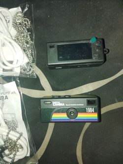 Mini digital camera with charger and chain
