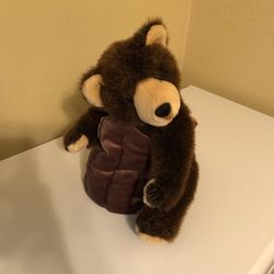 Bear in tree trunk 