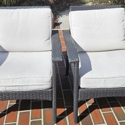 Grey wicker outdoor club chairs
