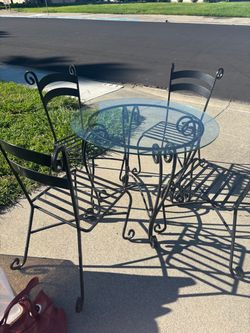 Wrought iron table & chairs