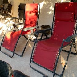 Two camp loungers with trays red material you’ve seen them for 120 bucks Used, but in good shape $40 a piece