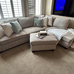 3-piece Living Spaces Beige Sectional.
