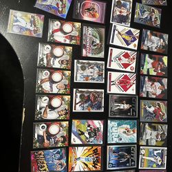 Baseball basketball and football cards