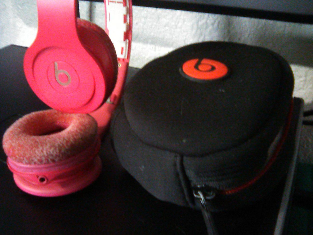 Beats by Dr. Dre pink headphones and case