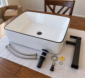 White Vessel Bathroom Sink with Black Faucet