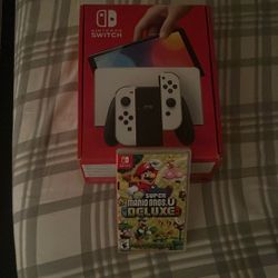 Nintendo Switch Oled With Super Mario Deluxe And Case 