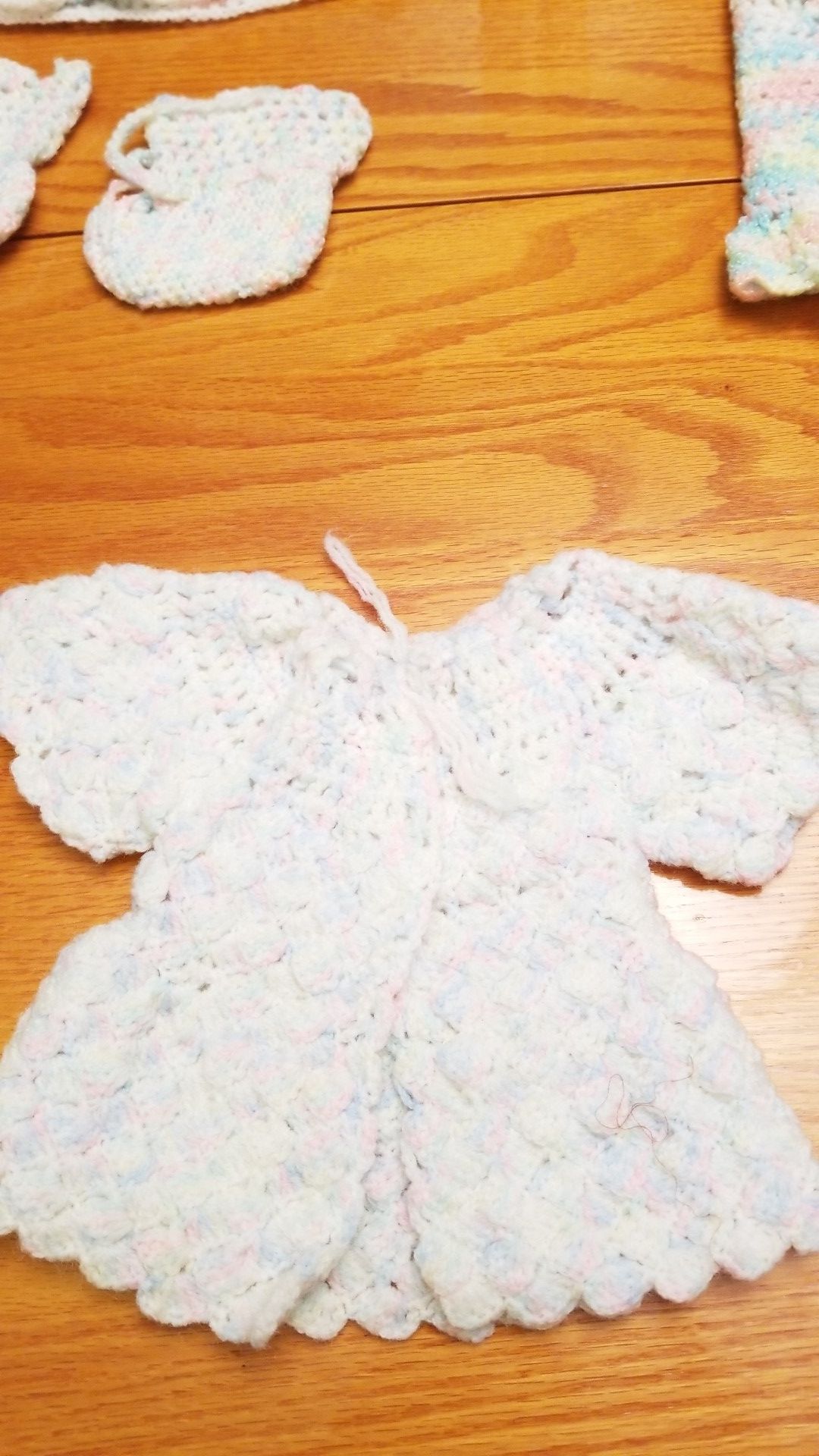 Crocheted baby clothes.