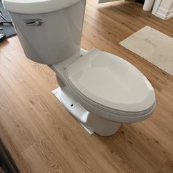 American Standard  toilet. Very clean.