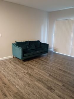 Teal suede love seat