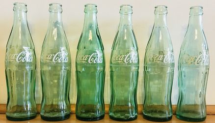 6 Vintage 12 oz. Coca Cola bottles with locations