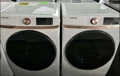 Samsung 27in.wide (5cu.ft.) Front load washer and 27in.wide (7.5 cu.ft.) electric dryer in ivory.