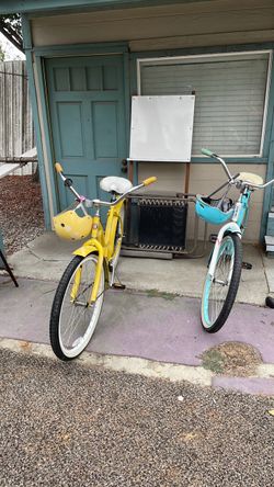 Two Cruiser Bikes – Yellow and Teal
