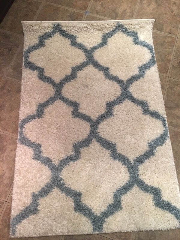 2 Ivory and blue accent rugs