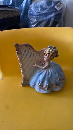 A Lady Playing the Instrument