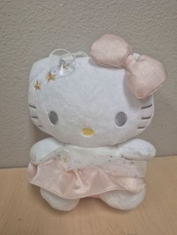 Sanrio Hello Kitty white and pink plush toy featuring gold star details.