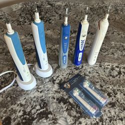 Electric toothbrush lot - 5 Oral B/Braun + 2 new toothbrush heads