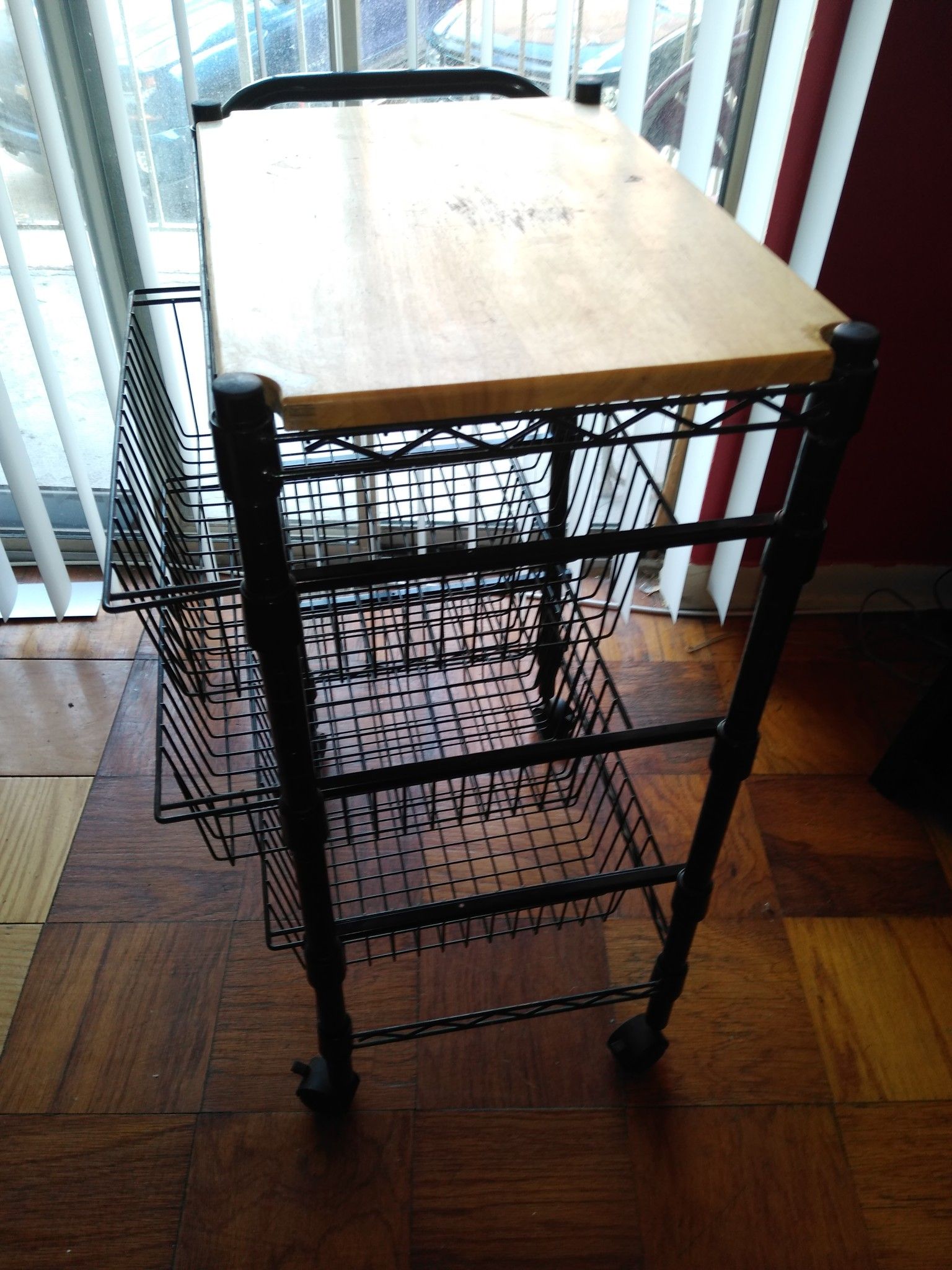 Rolling metal kitchen cart with wooden top