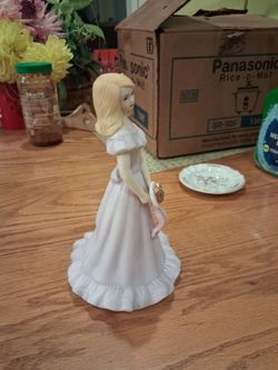 Porcelain growing up Girl Figurine in Pink Dress