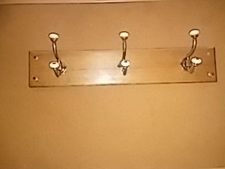 Three hook wall mounted hat rack