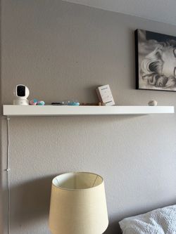 2 white floating shelves